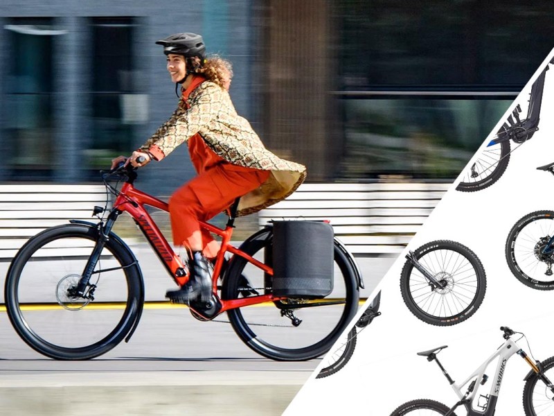 Frau auf einem E-Mountainbike auf der Straße.